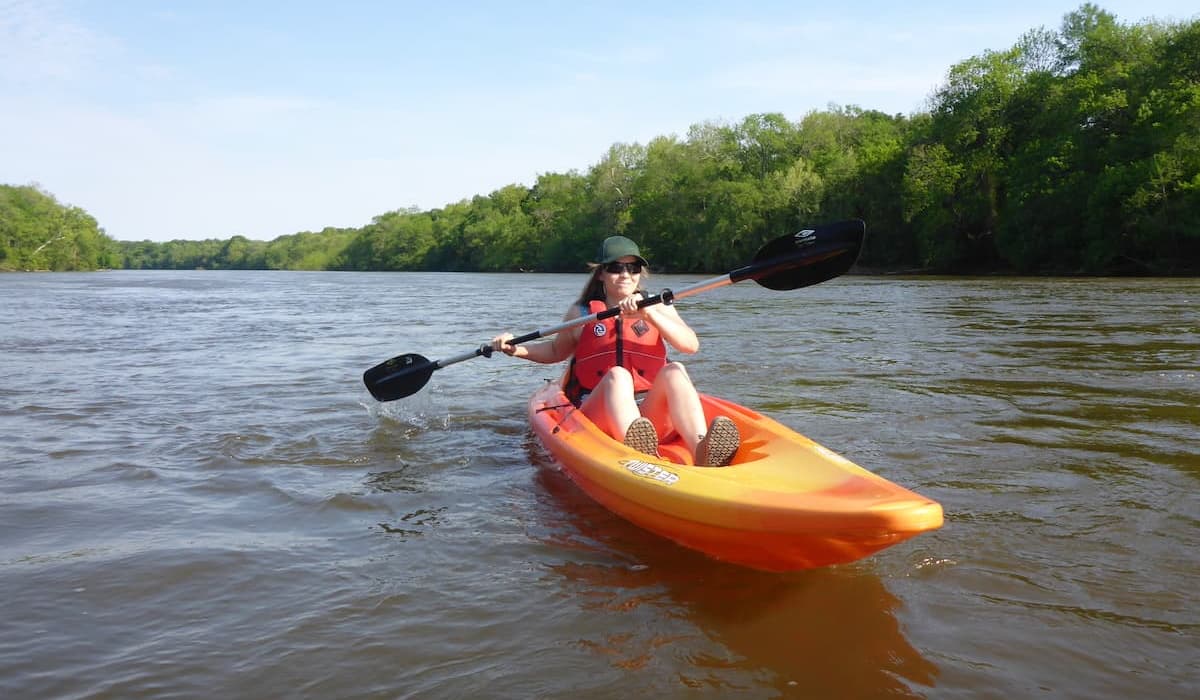A lady Kayaking on the Cape Fear River near Lillington, NC