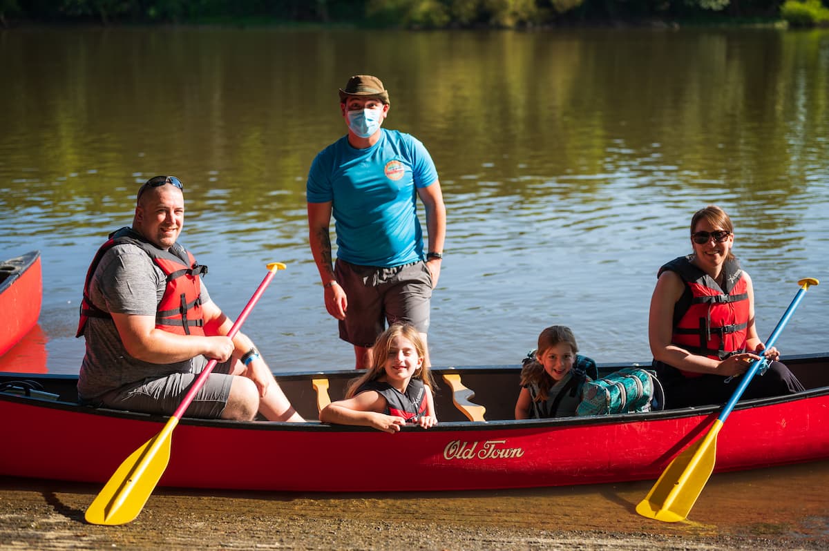 Family in canoe launching from the Cape Fear River Adventures ramp in Lillington, NC