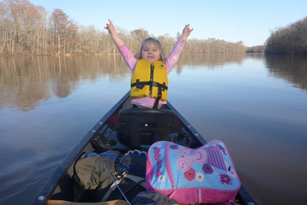 Girl canoeing on multi-day trip on the Cape Fear River