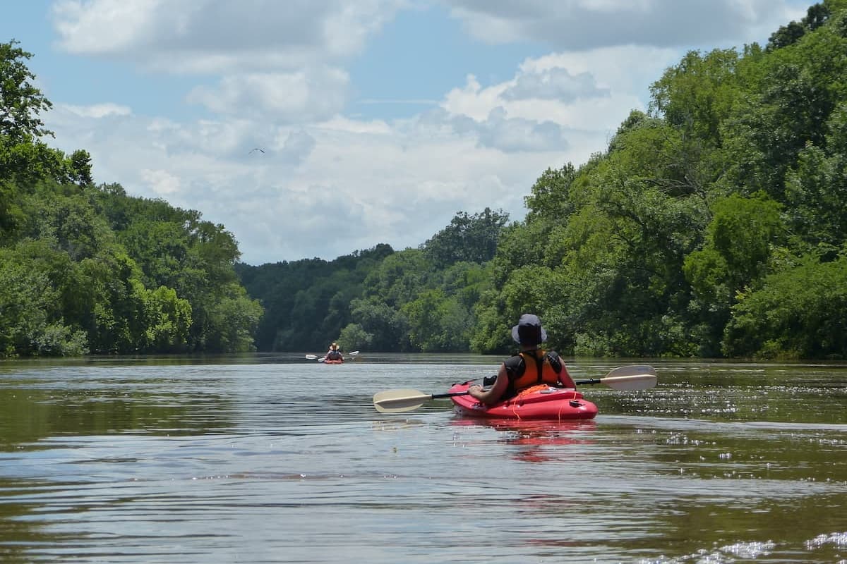 Kayaker enjoying sunny day on the Cape Fear River near Lillington, NC
