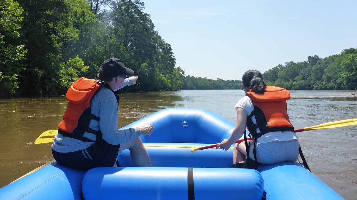 A couple whitewater rafting on the Cape Fear River near Lillington, NC