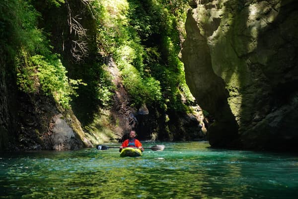 Kayaker enjoying the river around him with Pukon Kayak Retreat, Chile