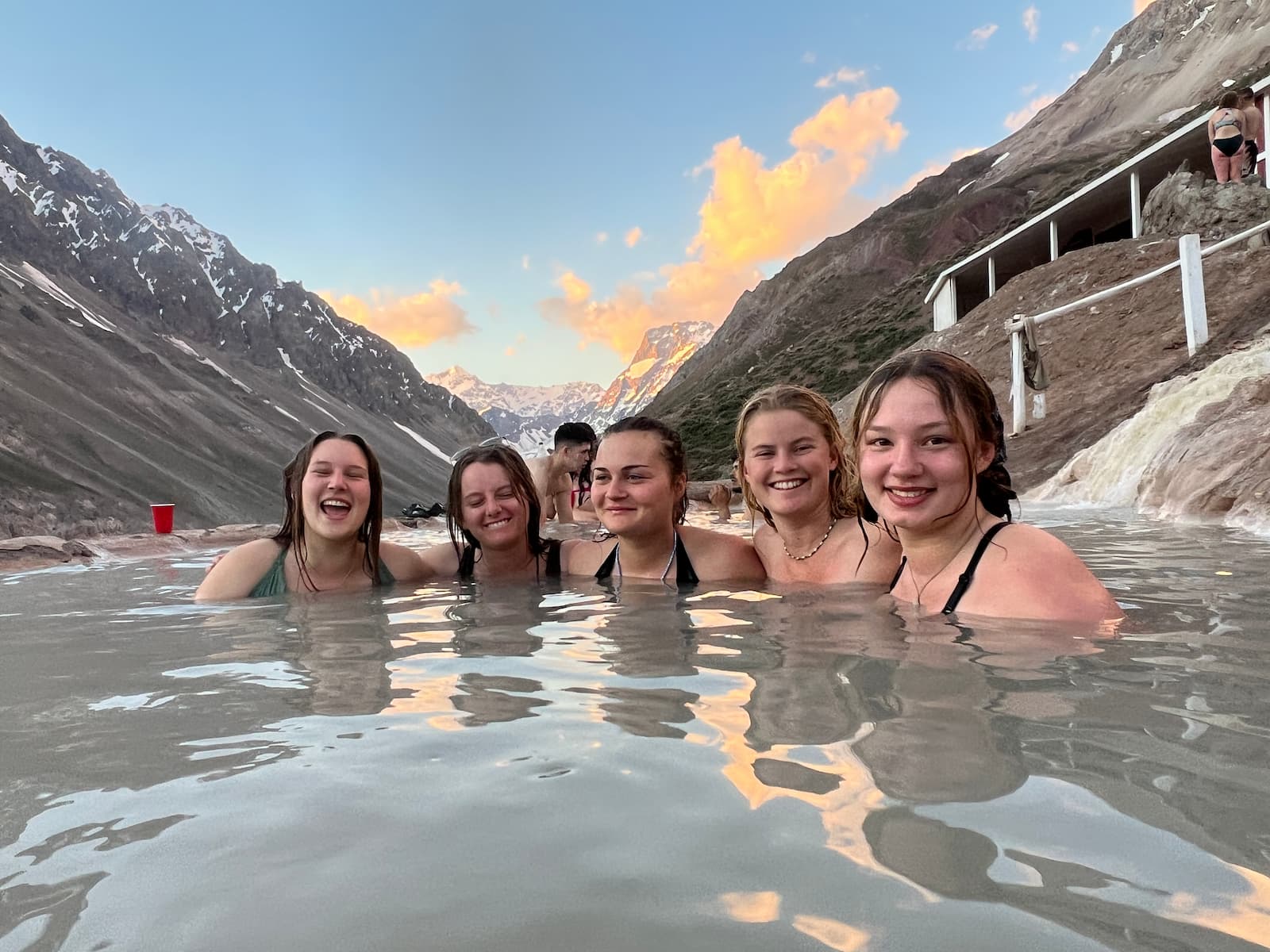 Ladies in hot springs with mountain view