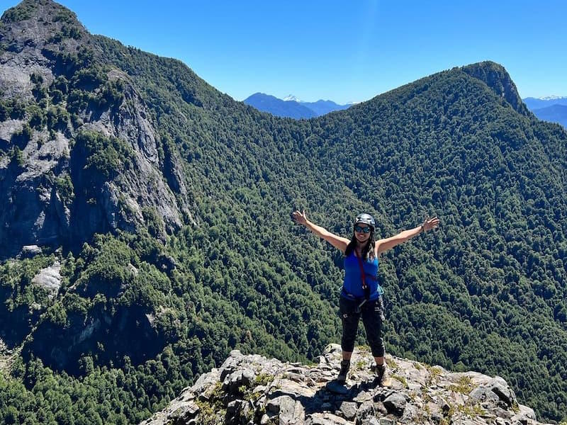 lady excited on mountain top in Pucón, Chile