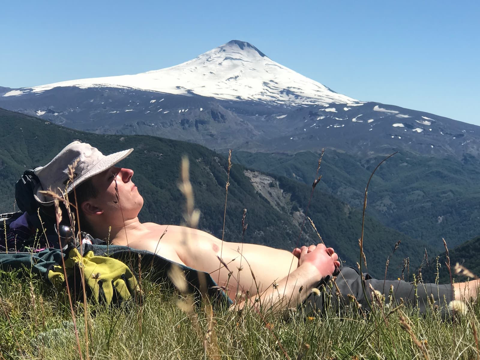 A guy taking a nap by volcano near Pucón, Chile