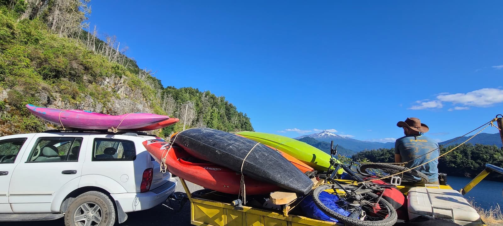 Kayaker below waters falls on the Upper Fay River near Pucón, Chile