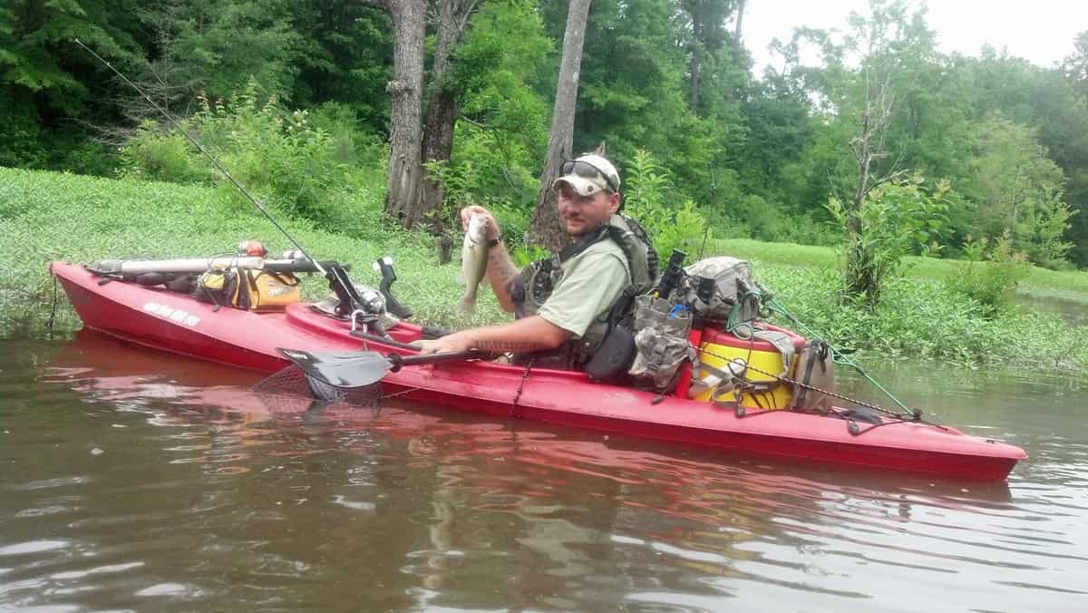 Kayaker catches fish on the Cape Fear River near Lillington, NC